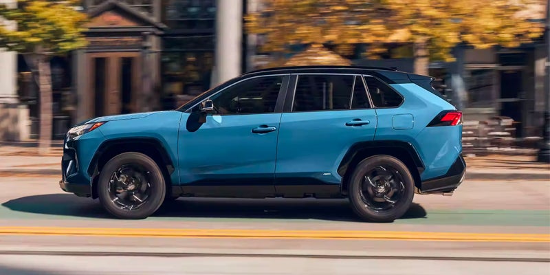 Side View of RAV4 Hybrid Traveling on Road Baltimore, MD